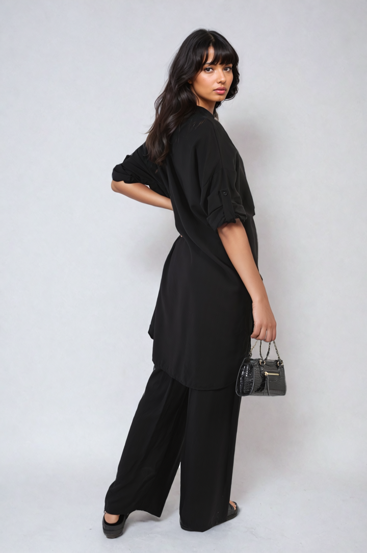 Woman wearing the Dulce Oversized Button Front Shirt & Wide Leg Pants Co-ord Set, showcasing a stylish and comfortable outfit ideal for casual, relaxed days.