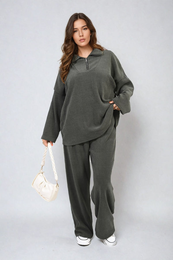 Woman in a grey Half Zipper Long Sleeve Top and Trouser Co-ord Set, holding a white purse, showcasing casual chic style from Holiday Clothes UK.