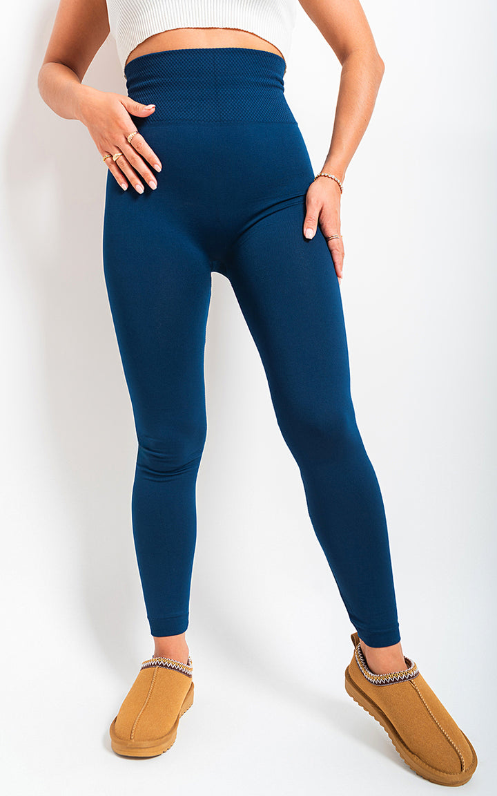 Woman wearing High Waist Tummy Compression Slimming Leggings, showcasing their fit and support, ideal for workouts and casual wear from Holiday Clothes UK.