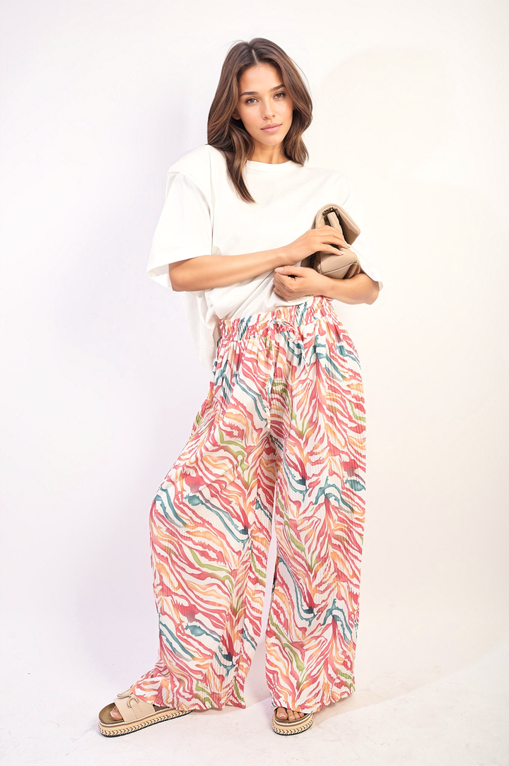 Woman modeling Pleated Wide Leg and Elastic Waist Trousers, showcasing elegant wide-leg design and comfort-focused elastic waistband, perfect for both casual and formal occasions.