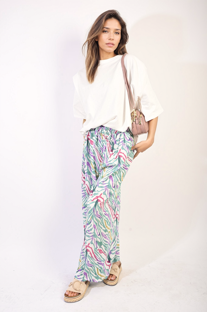 Woman wearing Pleated Wide Leg and Elastic Waist Trousers, showcasing their wide-leg design and comfortable fit, ideal for stylish and versatile wear.