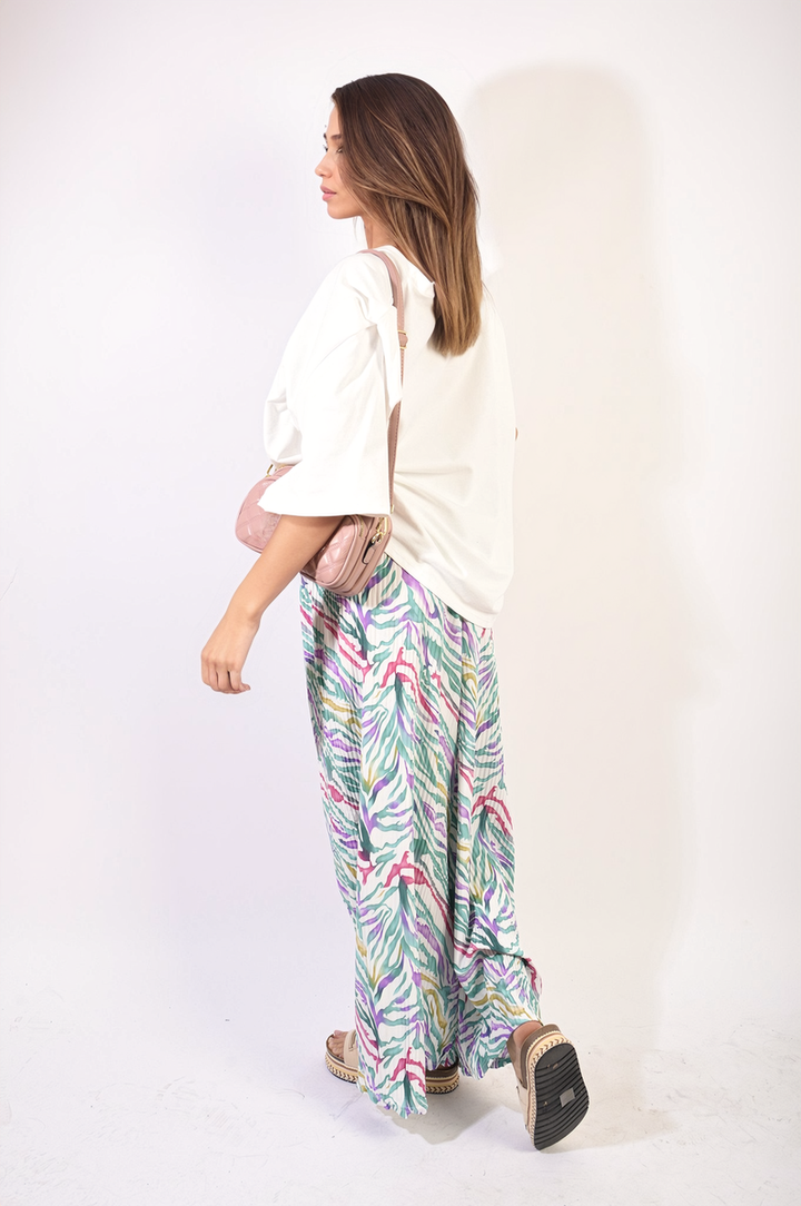 Woman wearing Pleated Wide Leg and Elastic Waist Trousers, showcasing a stylish and comfortable design ideal for versatile holiday and everyday wear.