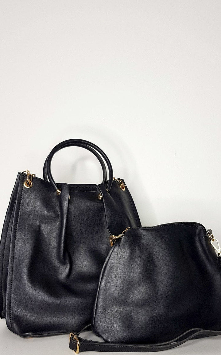 Black faux leather handbag with gold hardware, zip fastening, and detachable shoulder strap. Includes a smaller shoulder bag, ideal for casual everyday use.