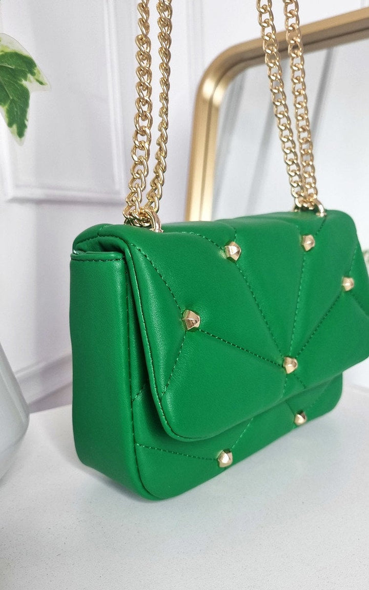 Studded with Chain Detail Handbag featuring a green faux leather design, gold chain accents, and studs, perfect for adding luxury to your style.