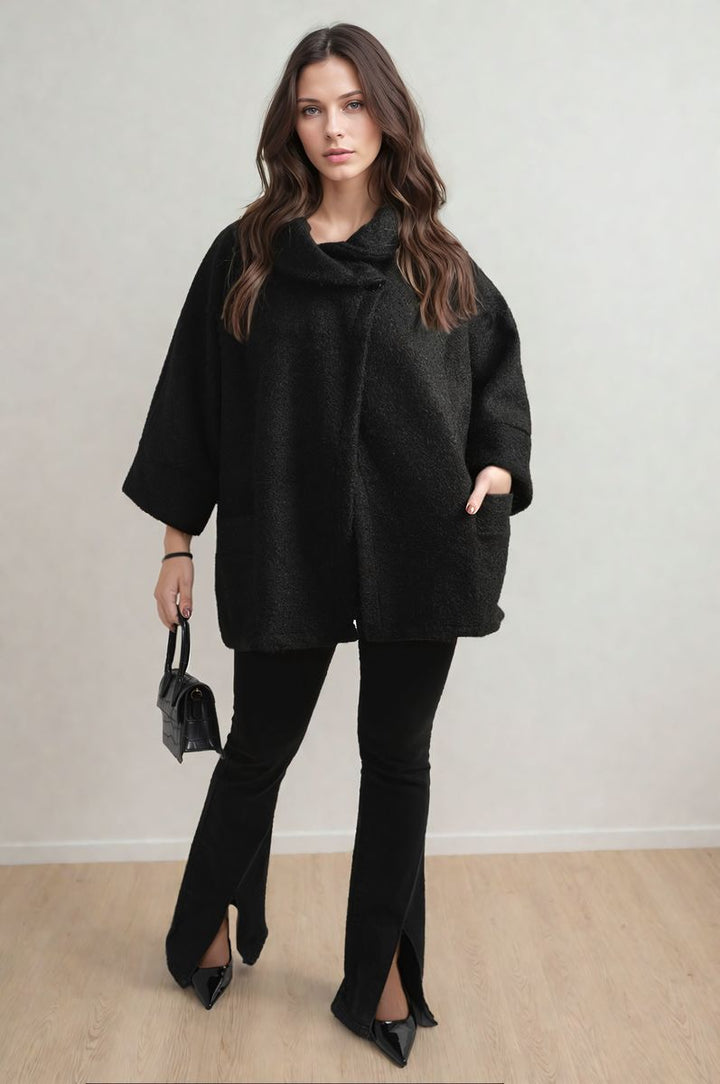 Elle Cowl Neck Oversized Cape Jacket worn by a woman, showcasing its chic oversized fit and trendy cape style.