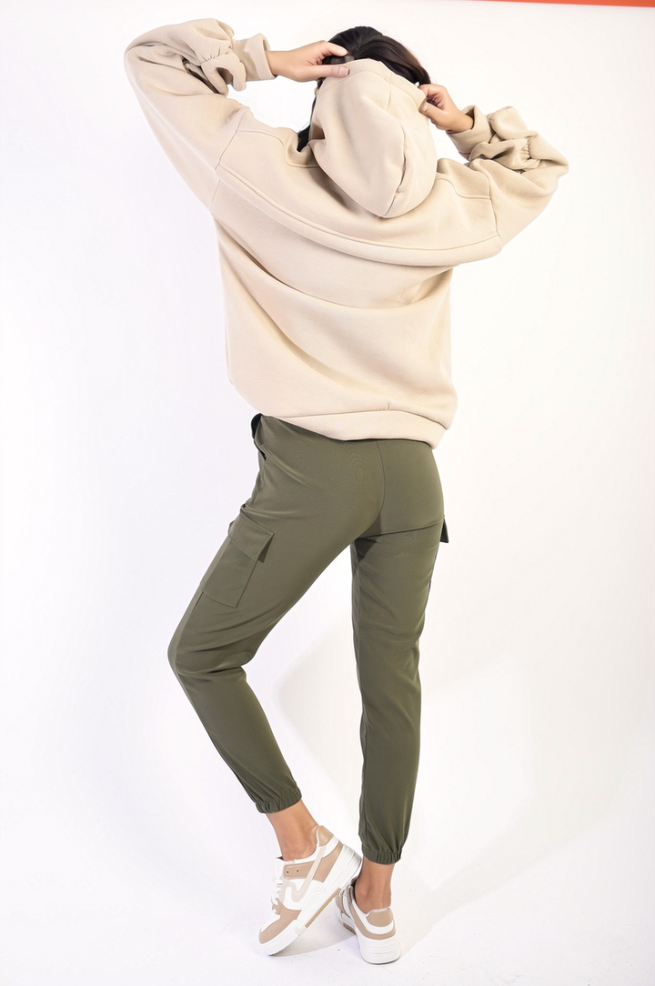 Person wearing Eloisa Cargo Pocket Trouser with Drawstring, showcasing versatile style and utility with visible cargo pockets and adjustable waist. Perfect for casual outings.