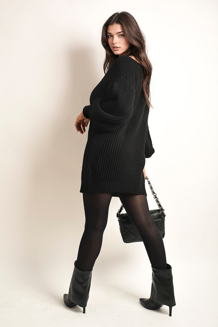 Woman in Chunky High Neck Knitted Jumper, styled with boots, showcasing cozy and chic fashion for fall and winter.