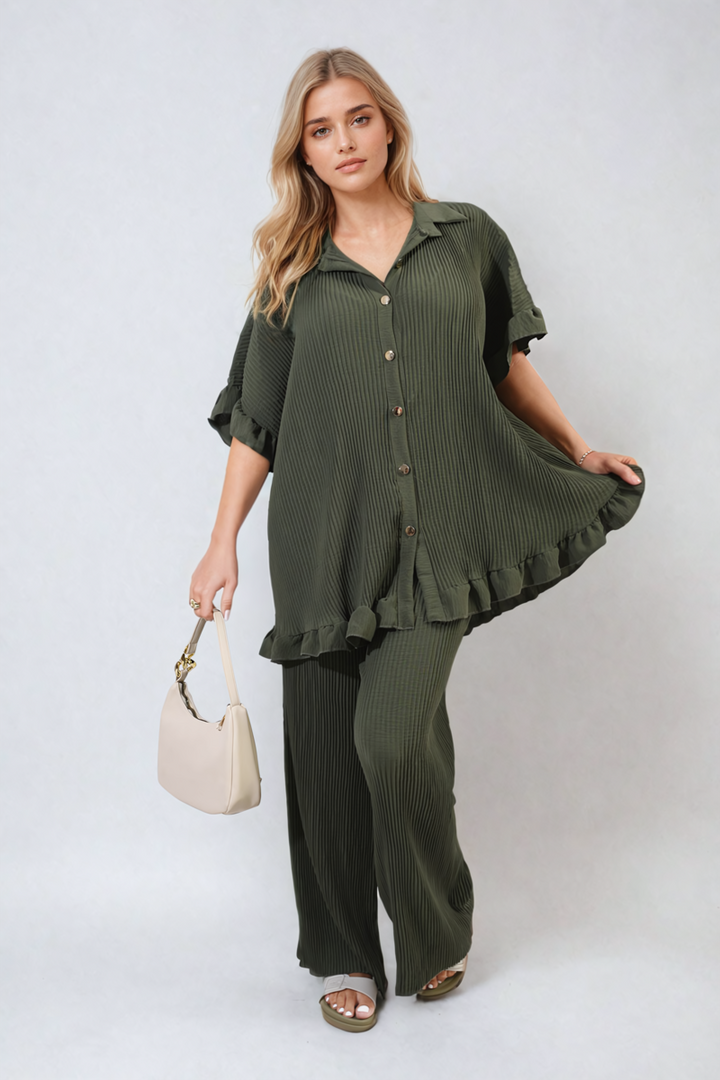 Woman modeling the Button Pleated Frill Ruffle Top and Wide Leg Trouser Co-ord Set, showcasing its elegant design and sophisticated style.