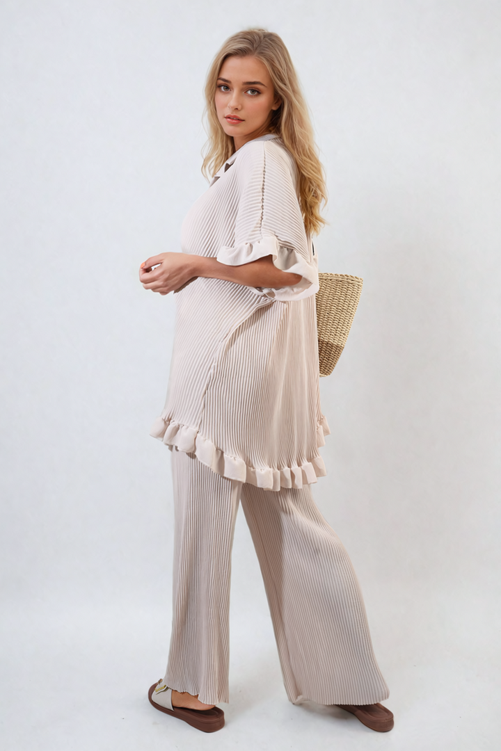 Woman wearing Emily Button Pleated Frill Ruffle Top and Wide Leg Trouser Co-ord Set, showcasing elegant frill details and wide-leg trousers for a chic look.