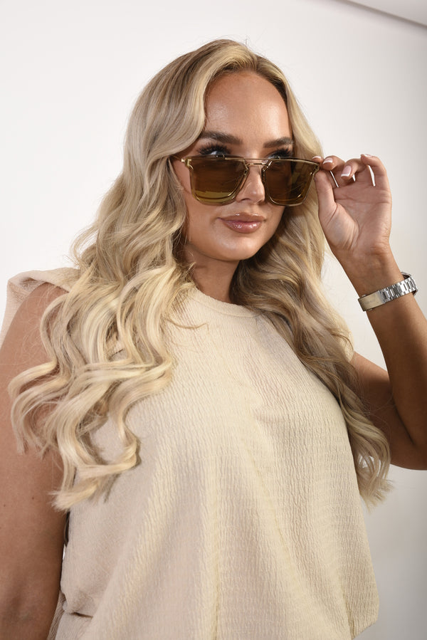 Woman wearing Erica Oversized Aviator Tinted Sunglasses, showcasing the bold design and oversized frame, perfect for stylish holiday and everyday wear.