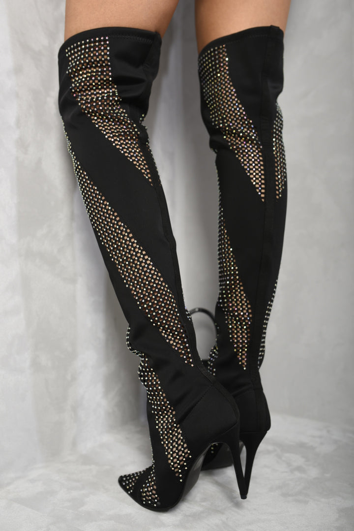 Rhinestone Mesh Knee High Boots with dazzling rhinestones and mesh design, worn by a person, adding sparkle and style to any outfit.