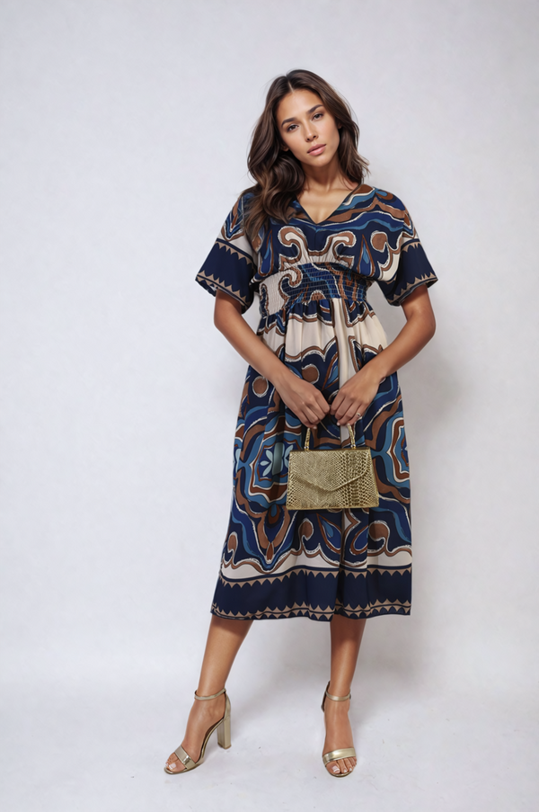 Woman in a Ruched Printed V-Neck Short Sleeve Midi Dress holding a gold purse, showcasing a stylish option for casual occasions.