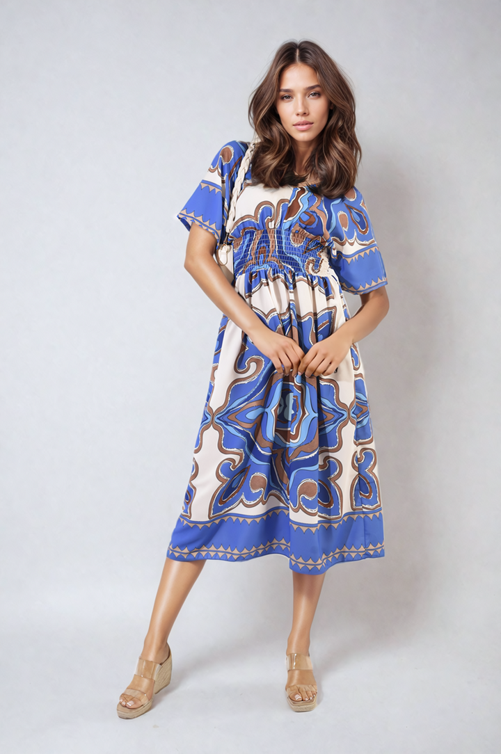 Woman wearing Ruched Printed V-Neck Short Sleeve Midi Dress with ruched design, suitable for casual occasions, from Holiday Clothes UK.