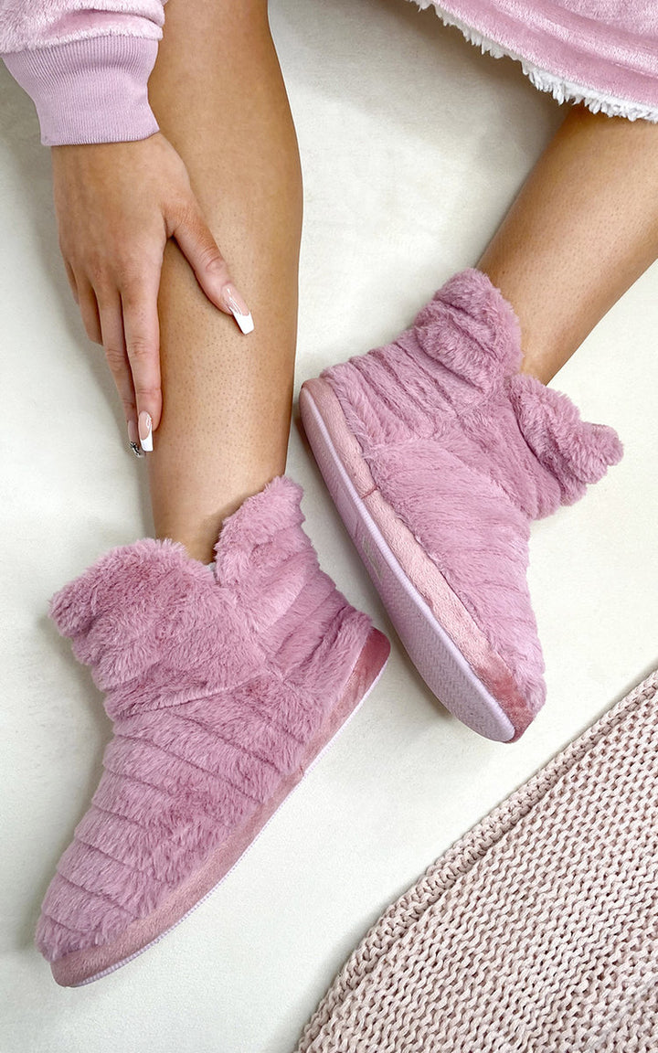 Faux Fur Slip on Cosy Slipper Booties, featuring luxurious faux fur, provide warmth and comfort, perfect for stylish indoor wear. Ideal for cozy holiday lounging.