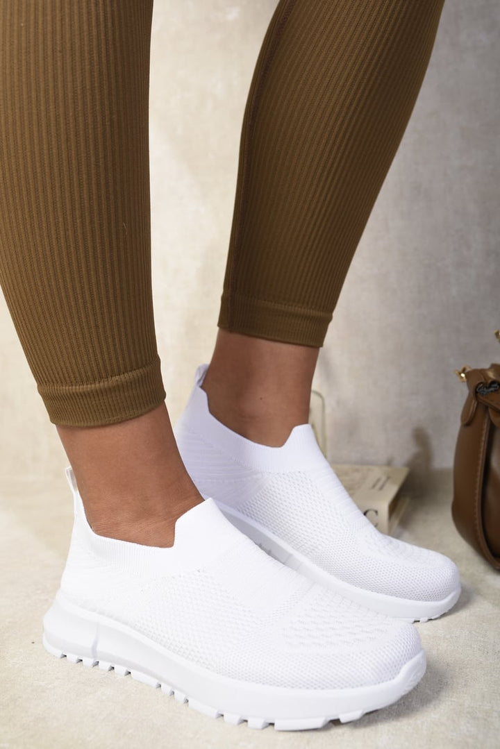 Knit Slip-On Zip Trainers showcased on feet, highlighting their breathable knit upper and easy slip-on design, perfect for stylish comfort and everyday wear.