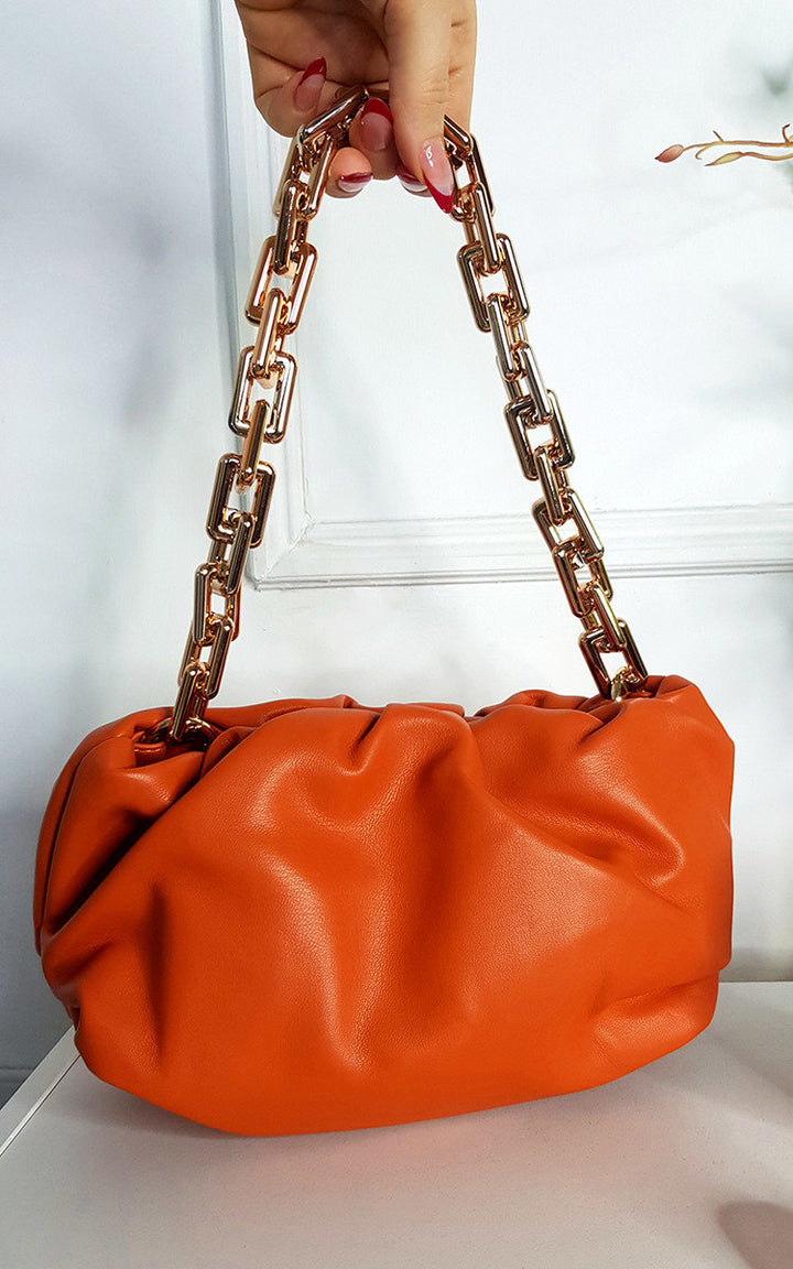 Faux Leather Shoulder Bag with Chain Detail, orange with gold chains, lightweight and roomy, perfect for carrying essentials stylishly.