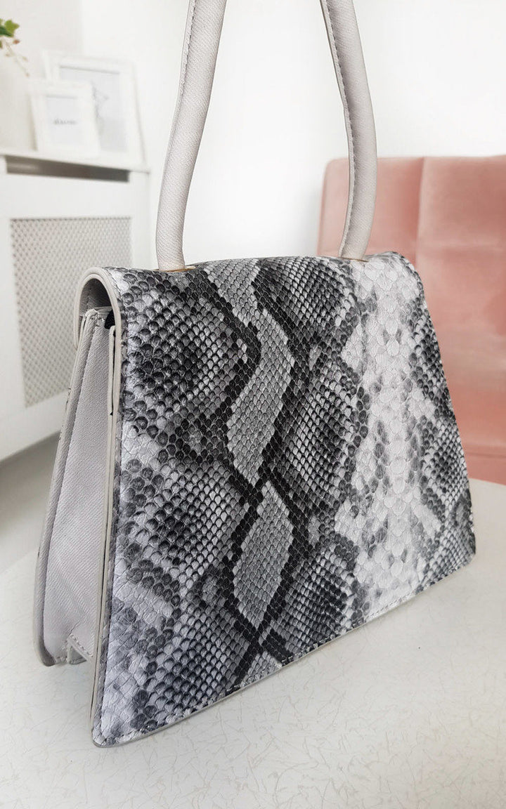 Croc Print Shoulder Handbag featuring a snake skin pattern, denim material, and white handle, ideal for stylish holiday and everyday use.