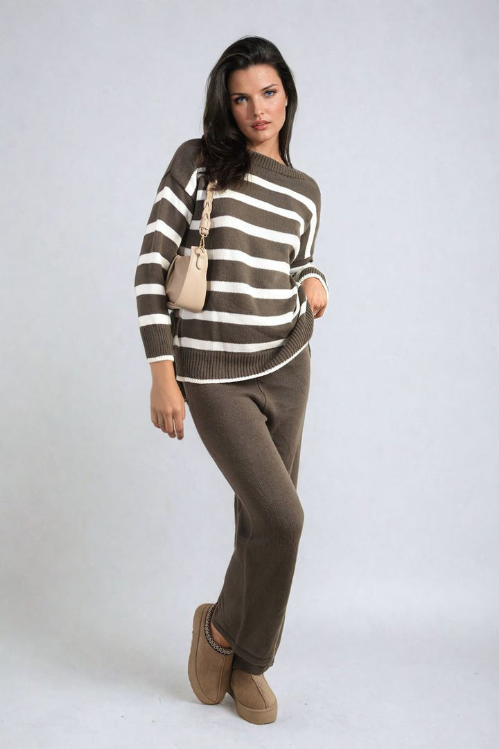 Woman wearing Knitted Striped Long Sleeve Top and Pants Co-ord Set, posing casually, showcasing the relaxed fit and stylish drop shoulder design.