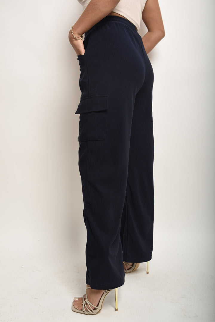 Wide Leg Drawstring Waist Flap Pocket Trouser showcased on a person, highlighting wide-leg design and functional flap pockets. Ideal for stylish yet comfortable wear.