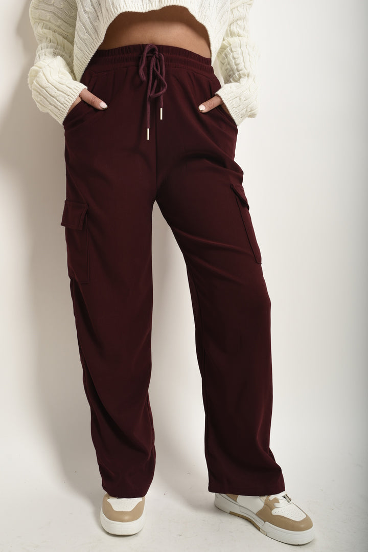 Person wearing Wide Leg Drawstring Waist Flap Pocket Trouser, showcasing the wide leg design and functional pockets, ideal for stylish comfort.