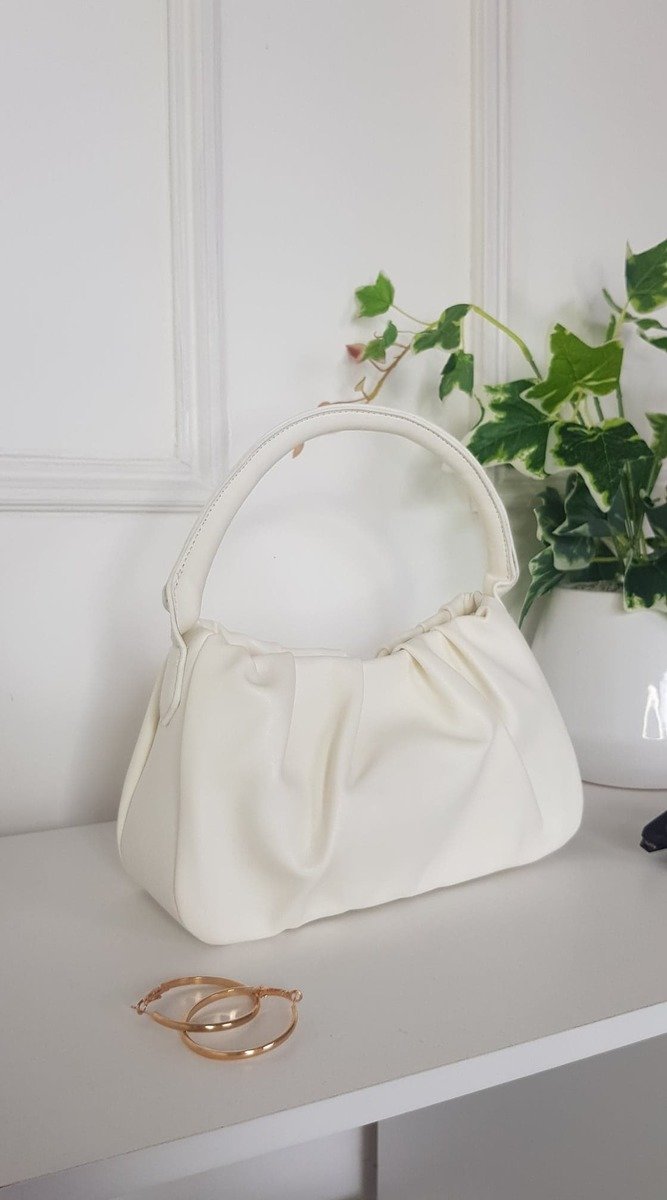 White Pouch Shoulder Handbag on display, featuring stylish faux leather design and pouch detail, ideal for versatile daily use.