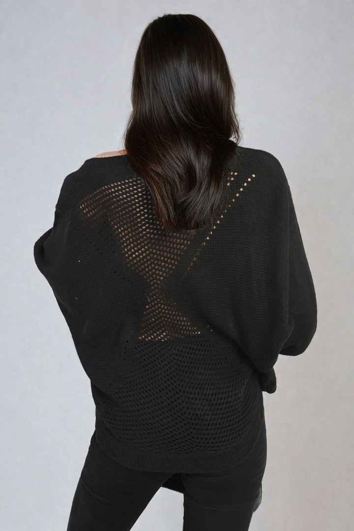 Woman wearing Crew Neck Back Patterned Knitted Jumper, showcasing its unique back design, ideal for casual outings and layering, offered by Holiday-clothes.co.uk.