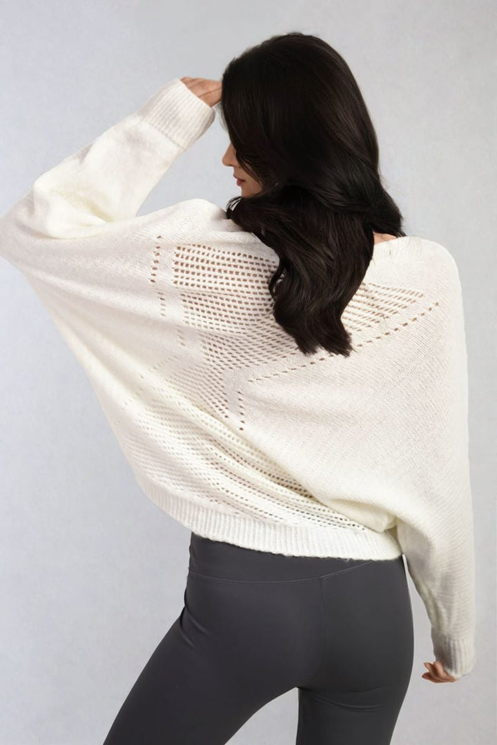 Woman wearing a Florencia Crew Neck Back Patterned Knitted Jumper, showcasing its chic style and unique back pattern, ideal for casual outings.