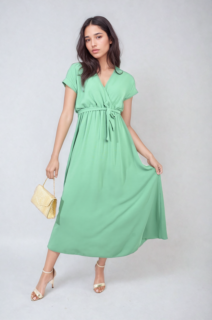 Woman in Wrap Tie Waist Short Sleeve Midi Dress, showcasing elegant wrap design and adjustable waist, perfect for versatile, stylish occasions from Holiday Clothes UK.