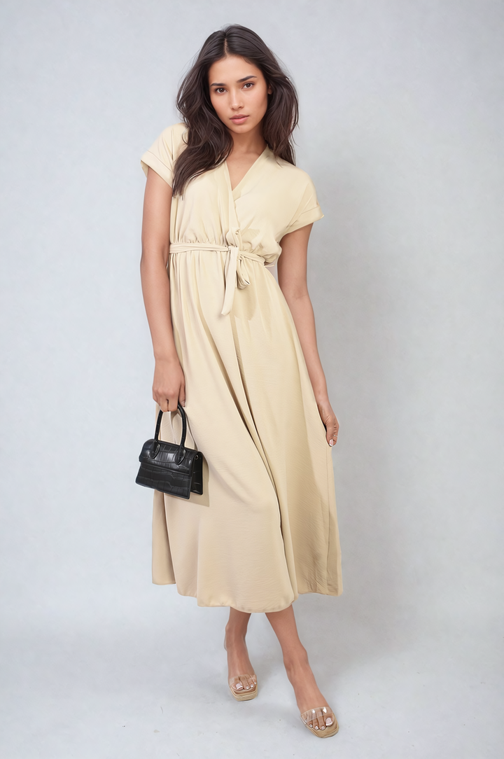 Woman wearing Wrap Tie Waist Short Sleeve Midi Dress, holding a black purse, paired with clear sandals. Suitable for versatile occasions. Shop online at Holiday Clothes UK.