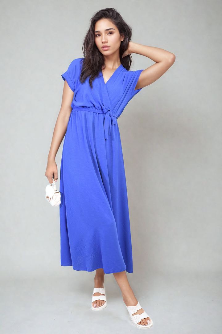 Woman wearing the Francesca Wrap Tie Waist Short Sleeve Midi Dress, showcasing its wrap design and adjustable tie waist, perfect for versatile styling.