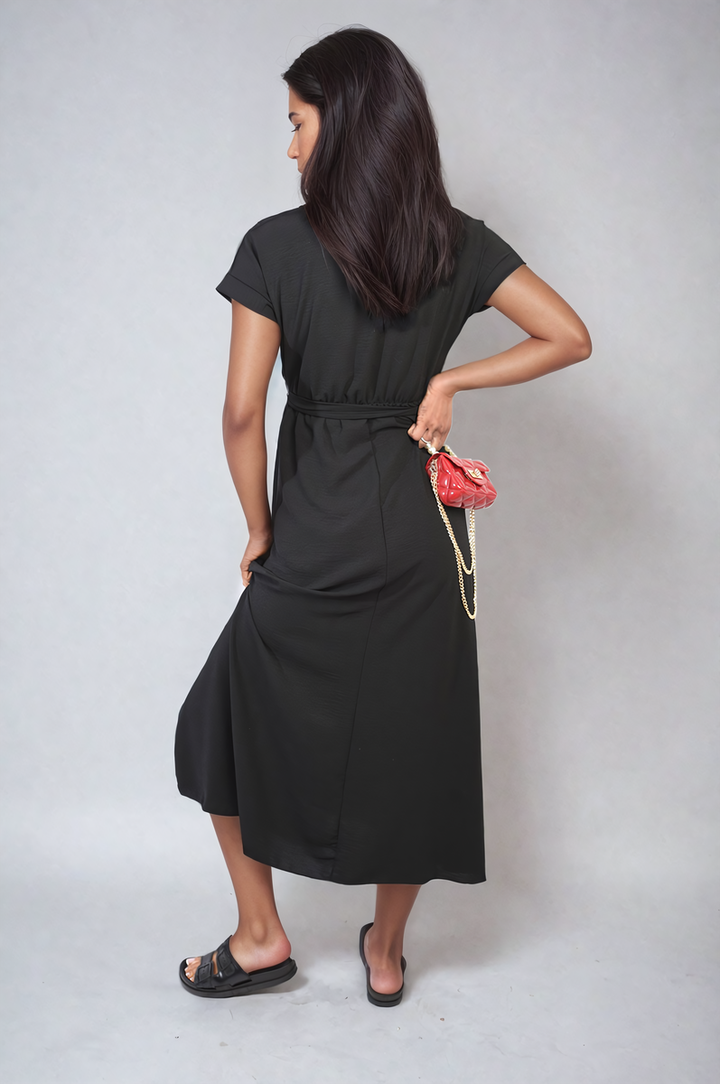 Wrap Tie Waist Short Sleeve Midi Dress worn by a woman, showcasing its elegant wrap design and adjustable tie waist for a flattering silhouette.