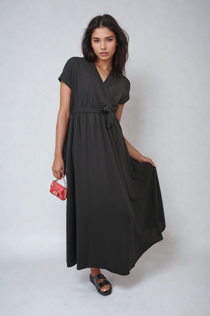 Wrap Tie Waist Short Sleeve Midi Dress worn by a woman, showcasing its wrap design and adjustable tie waist, ideal for stylish holiday wear and everyday elegance.