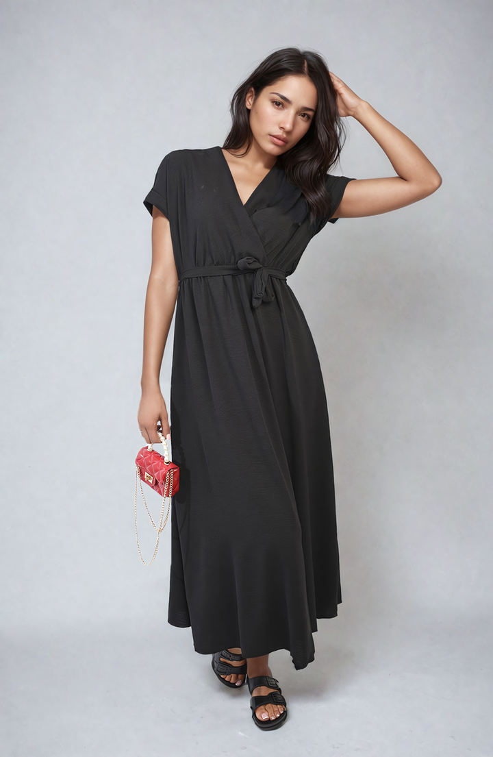 Woman wearing the Francesca Wrap Tie Waist Short Sleeve Midi Dress, showcasing its elegant wrap design and adjustable waist, perfect for versatile styling.