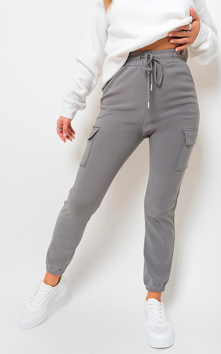 Woman wearing Fleece Lined Cargo Pocket Trouser with Drawstring, showcasing stylish utility with practical cargo pockets and a comfortable fit. Perfect for versatile, everyday adventures.