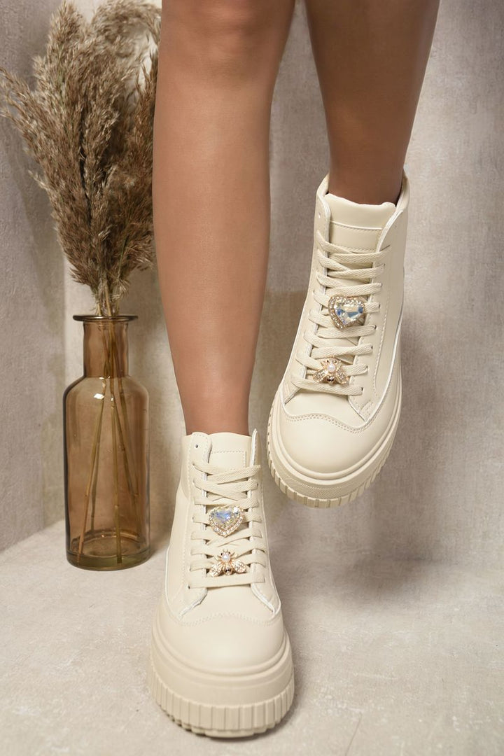 Lace Up High Top Platform Trainers with Decorative Details, featuring gemstones and a bee brooch on the laces, perfect for stylish everyday adventures.