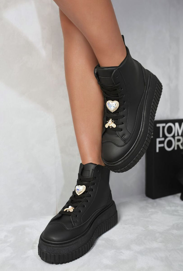 Lace Up High Top Platform Trainers with Decorative Details, showcasing stylish black footwear with rhinestones, perfect for adding height and flair to casual outfits.