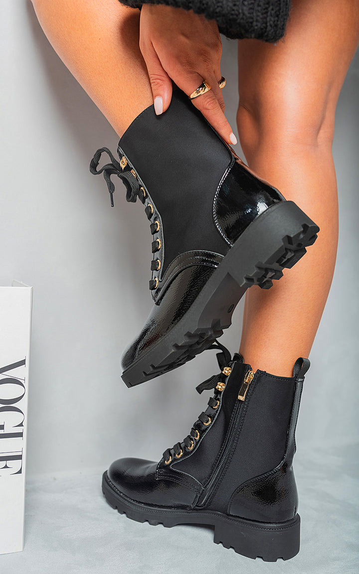 Lace Up Combat Chunky Sole Biker Ankle Boots being worn, showcasing their edgy lace-up design and chunky sole, perfect for a bold, stylish look.