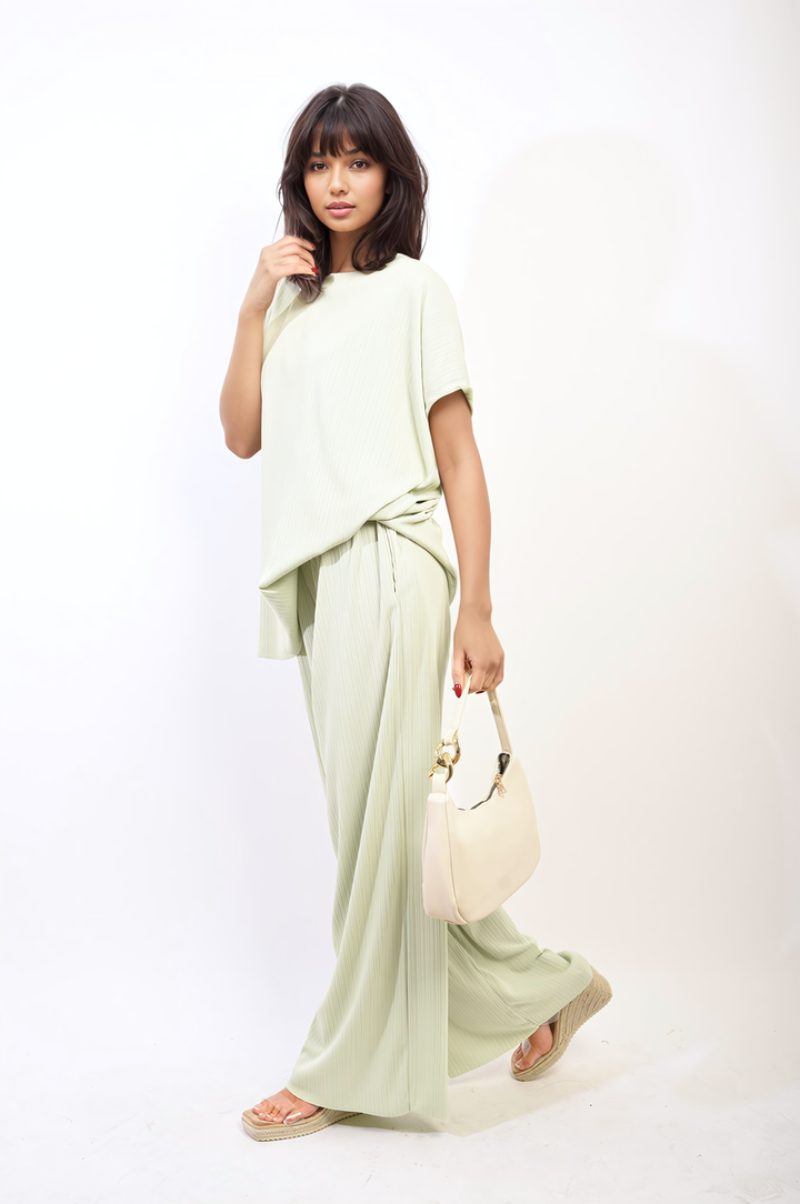 Woman modeling the Gabriella Oversized Top and Wide Leg Trouser Co-ord Set, showcasing a relaxed, elegant fit perfect for stylish, everyday wear.