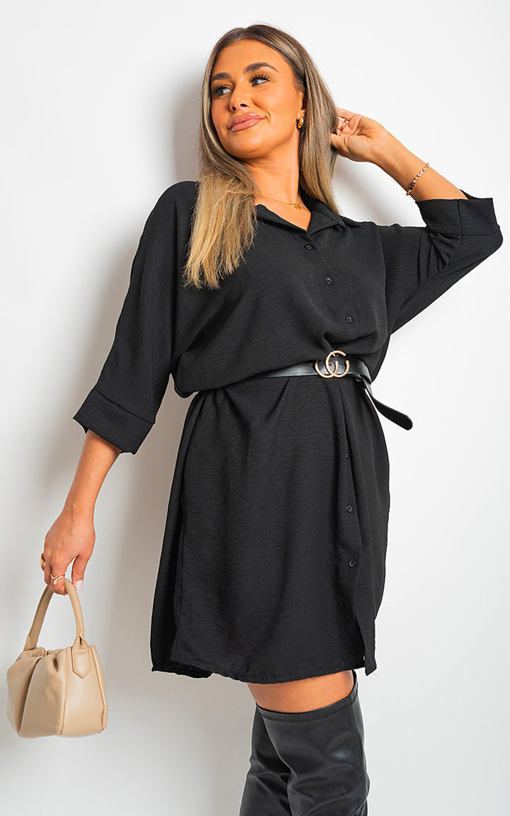 Collared Button Down Mini Dress with gold-buckled belt, worn by a woman; features a chic A-line silhouette and collared neckline, ideal for stylish occasions.