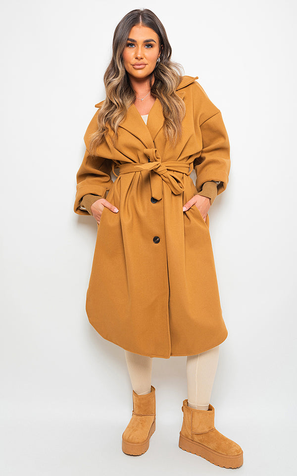 Woman wearing Giana Oversized Belted Trench Coat, showcasing its elegant, roomy fit and sophisticated design, perfect for stylish layering and versatile wear.