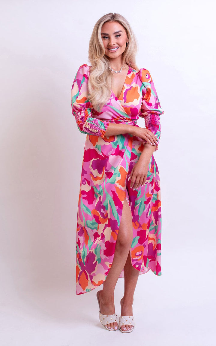 Wrap Front Printed Midi Dress featuring a colorful design, modeled by a smiling woman, showcasing its flattering wrap front and midi length for stylish occasions.