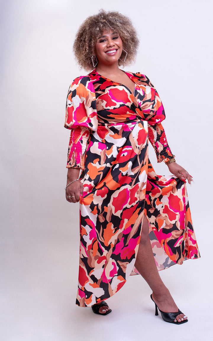 Woman in a Wrap Front Printed Midi Dress with colorful pattern, showcasing a stylish and flattering design, perfect for special occasions or nights out.