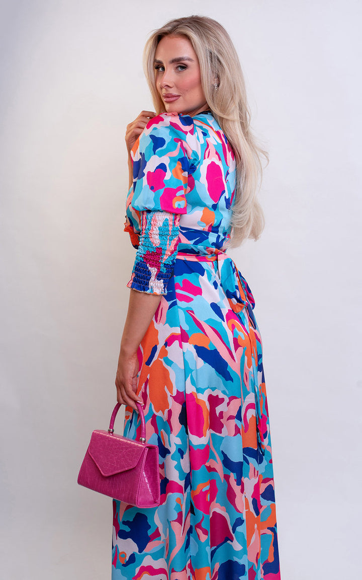 Wrap Front Printed Midi Dress featuring a colorful pattern, worn by a woman, showcasing a stylish and flattering design perfect for special occasions.