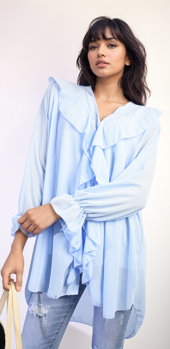 Woman in Oversized Ruffle Long Sleeve Tops with ruffle sleeve detail, showcasing a relaxed, stylish fit for versatile wear. Ideal for casual and chic occasions.