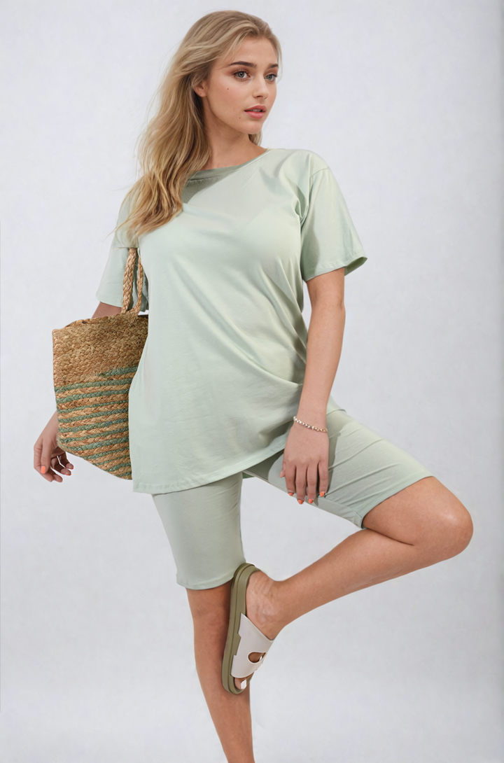 Woman in a green Hazel Loose Fit Top and Biker Shorts Co-ord Set, showcasing a casual, stylish outfit perfect for lounging or casual outings.