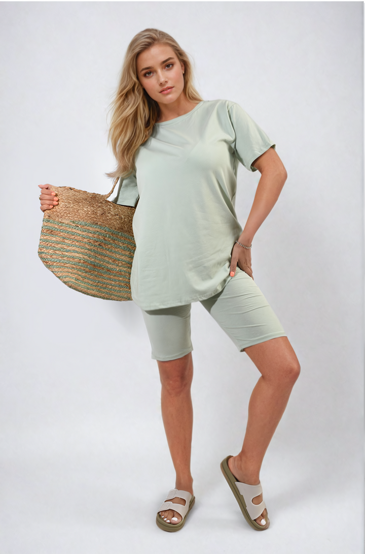 Woman holding straw bag while wearing the Hazel Loose Fit Top and Biker Shorts Co-ord Set, showcasing casual style and comfort from Holiday-clothes.co.uk.