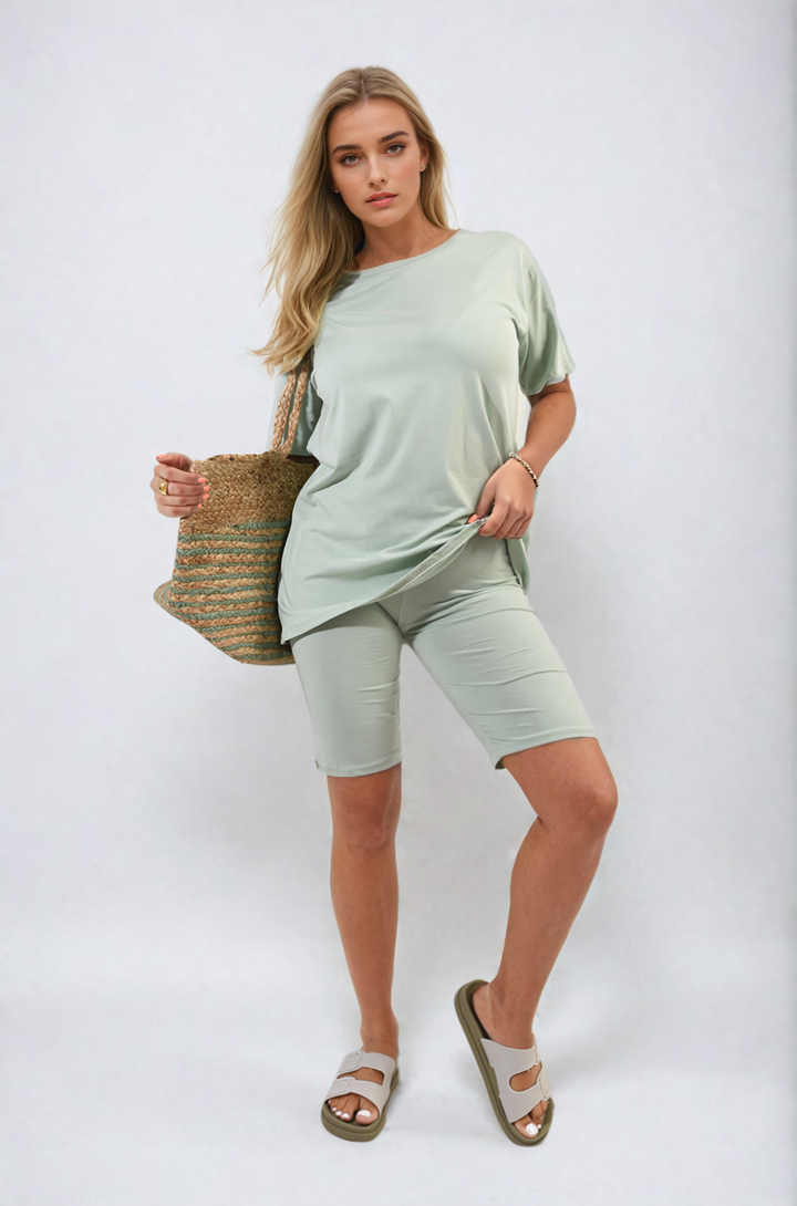 Woman wearing Loose Fit Top and Biker Shorts Co-ord Set, holding a handbag, showcasing a casual, relaxed style perfect for everyday wear.