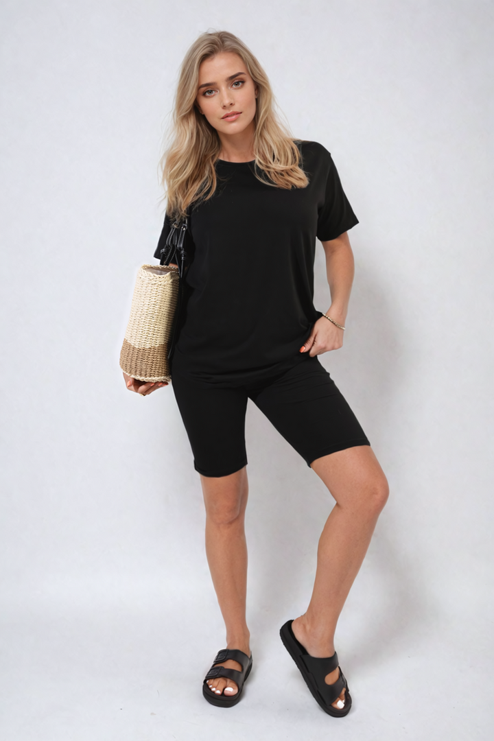 Woman modeling the Hazel Loose Fit Top and Biker Shorts Co-ord Set, showcasing its relaxed top and snug shorts, ideal for casual comfort.