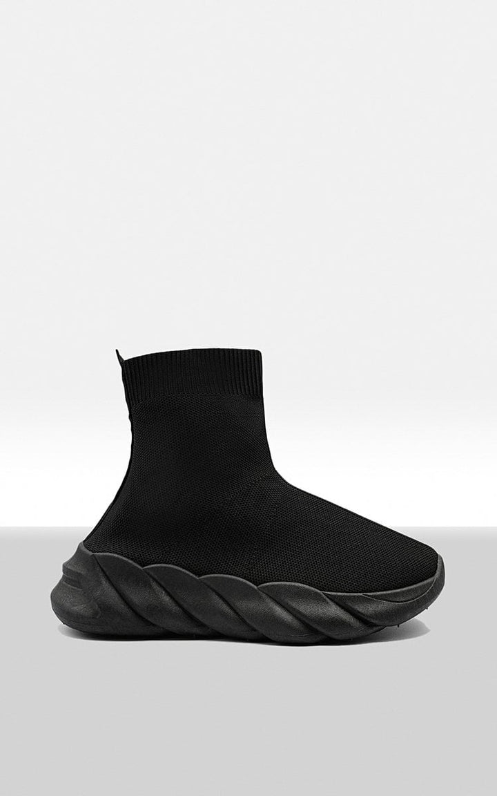 Chunky Sole Knitted Sock Trainers with a sleek black design, featuring a snug, sock-like fit and a bold, supportive chunky sole for comfort and style.