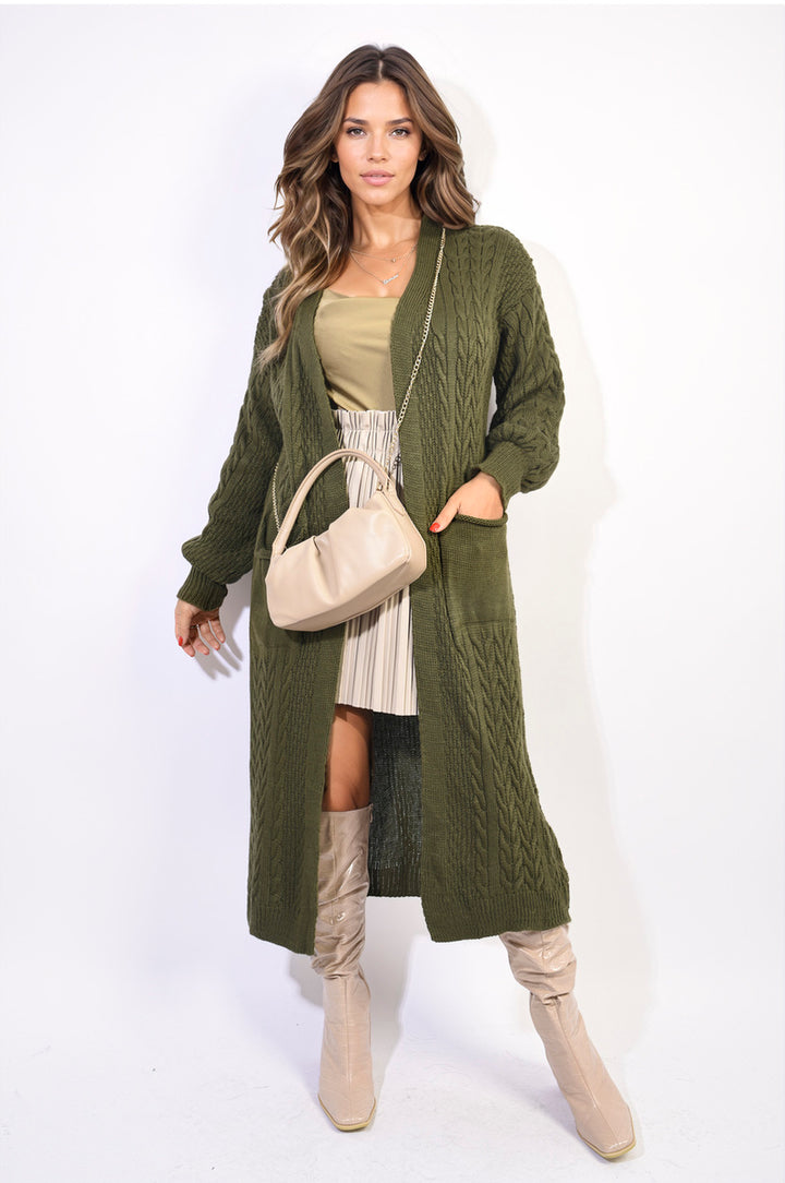 Woman wearing a Front Open Long Knitted Cardigan with Front Pockets, styled with a beige handbag, showcasing casual elegance and practicality.